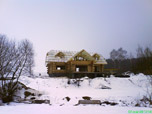 Portfolio/Log house in a field