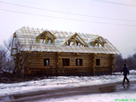 Portfolio/Log house in a field